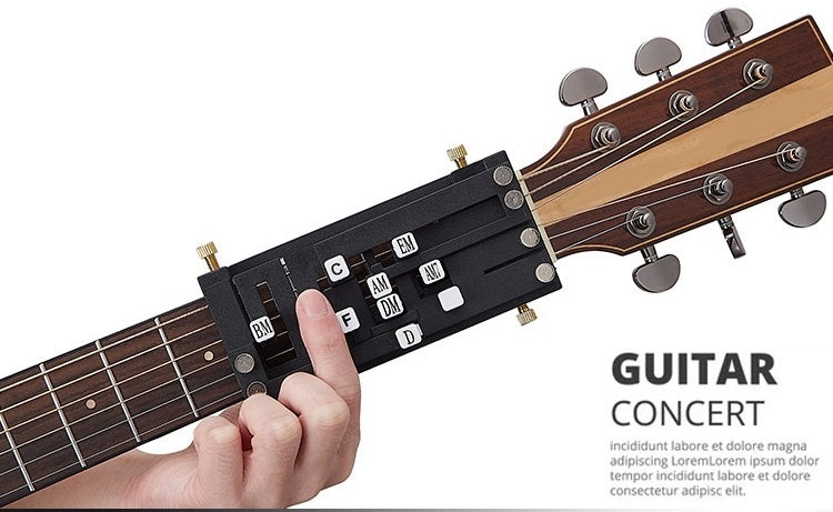 Beginner guitar chord presser helper attached to acoustic guitar neck. Finger pressing the ‘G’ chord button for easy chord formation.